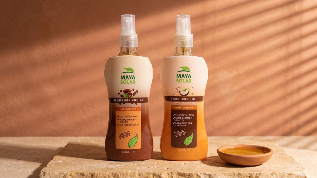 Lociones Bronceadoras Naturales Xocolat y Coco de Maya Solar de 250 ml de pie sobre una losa de piedra caliza, junto a un plato de barro con aceite, con la luz de una persiana rayando la pared